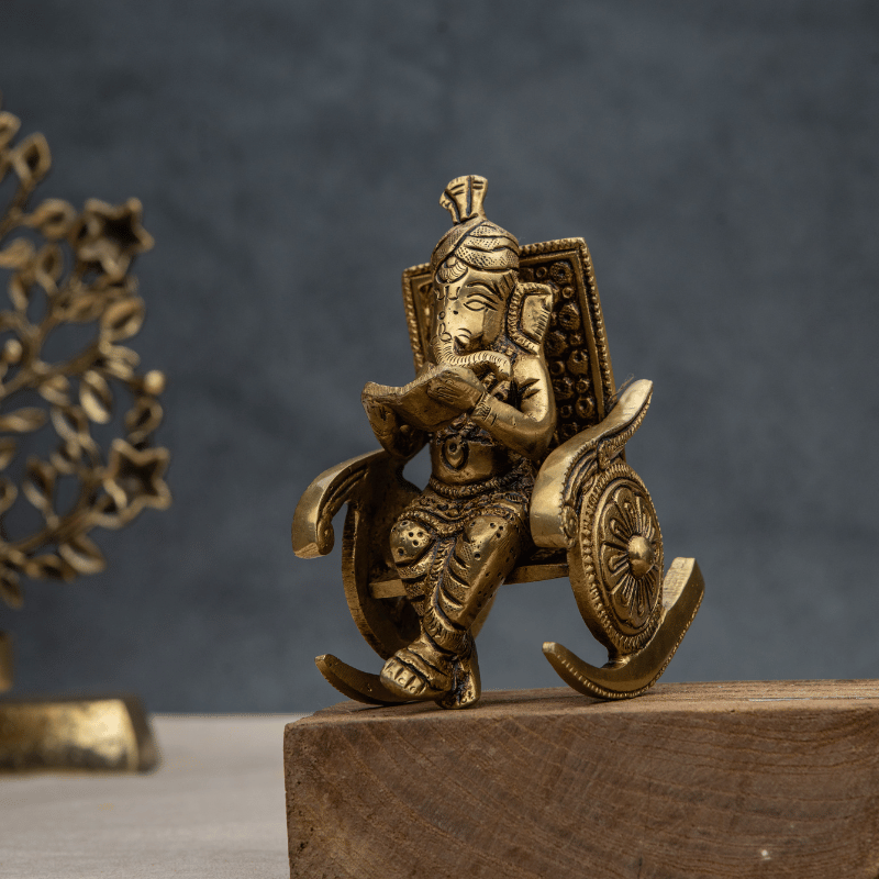 Handcrafted Brass Ganesha on Rocking Chair Reading a Book – Seated Ganesha Idol